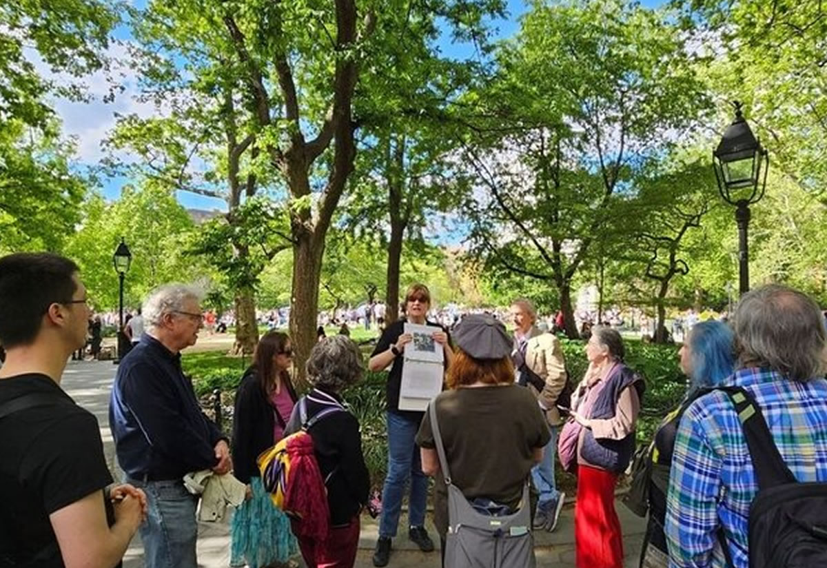 Ann MeDermott with a tour group at Washington Square Park, scene of the folk riots